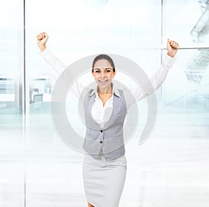 Business woman excited hold hands up raised arms
