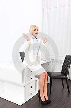 Business woman excited hold hands up raised office