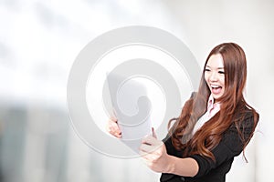 Business woman excited looking at Tablet pc