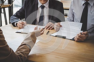 Business woman explaining about his profile to two selection committee manager sitting in during job Interview, interview the job