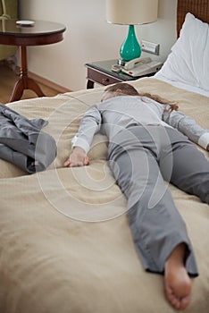 Business woman fall down from exhaustion in room