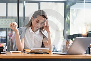 Business woman feeling stress, burnout, upset about job failure, paperwork mistakes, overwork. Nervous breakdown at work