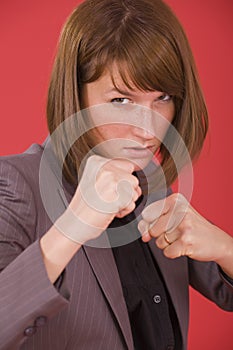 Business woman in fighting stance