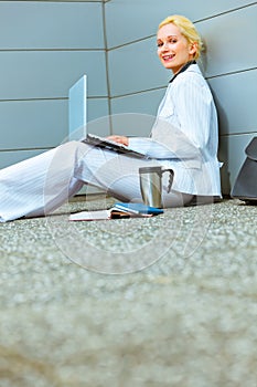 Business woman on floor at office building