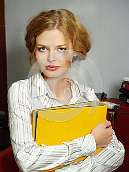 Business woman with a folder for papers