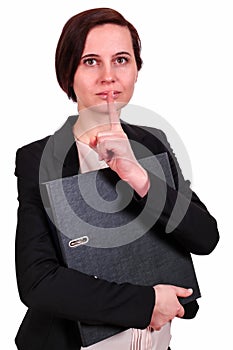 The business woman with a forefinger at a mouth
