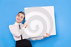 Business woman in formal wear with white panel on blue background