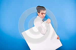 Business woman in formal wear with white panel on blue background