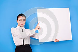 Business woman in formal wear with white panel on blue background