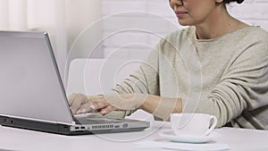 Business woman freelancer typing on laptop, working home, emailing with client