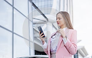 Business woman in front of office building