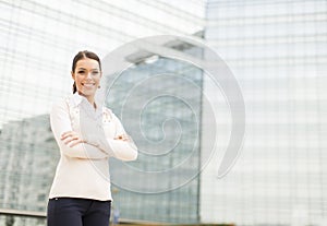 Business woman in front of office building