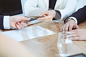 Business woman giving pen to businessman ready to sign contract. Success communication at meeting or negotiation