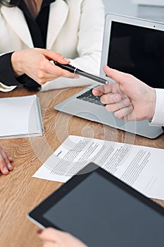 Business woman giving pen to businessman ready to sign contract. Success communication at meeting or negotiation