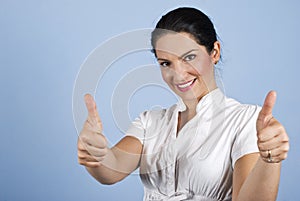 Business woman giving thumbs up