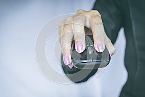 Business woman hand holding mouse