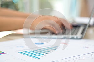 Business woman hand typing on laptop keyboard