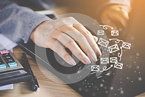 Business woman hand working on computer laptop sending email photo