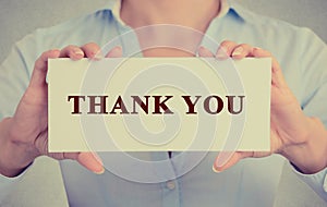 Business woman hands holding sign or card with message thank you