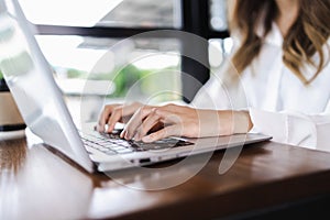 Business Woman hands typing on computer keyboard. Business Woman working on laptop