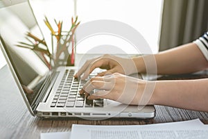 Business woman hands typing on laptop keyboard, notebook keyboard