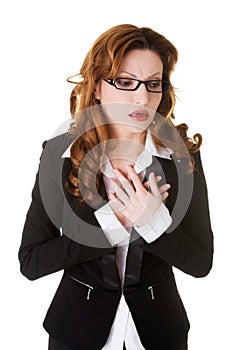 Business woman having heart attack.