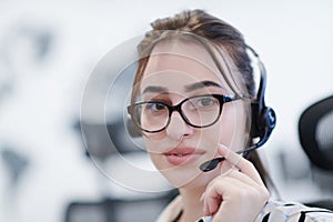 Business woman with headsets at work