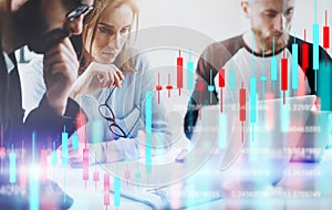 Business woman and her collegues sitting front laptop computer with financial graphs and statistics on monitor. Double