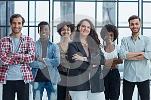 business woman with her staff in background at office photo