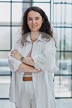 business woman with her staff in background at office photo