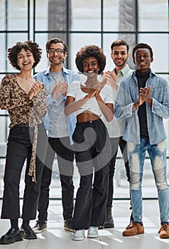 business woman with her staff in background at office photo