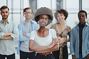 business woman with her staff in background at office photo