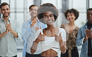 business woman with her staff in background at office photo