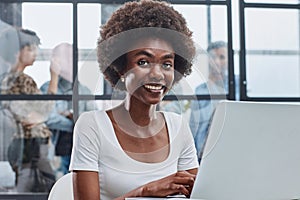 business woman with her staff in background at office photo