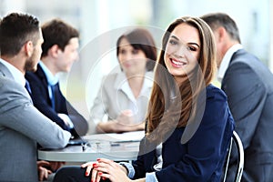 Business woman with her staff, people group in background