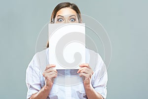 Business woman hide face behind white sign board