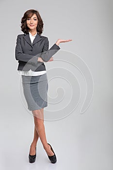 Business woman hoding copyspace on palm