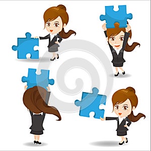 Business woman hold puzzle