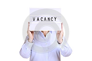 Business woman hold signboard with vacancy text on it. Recruitment and hiring concept