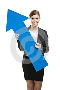 Business woman holding a blue arrow