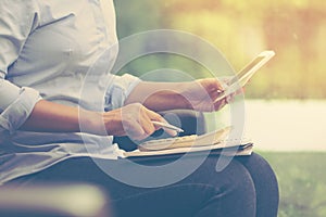 Business woman holding credit card with mobile smart phone and u