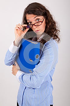 The business woman is holding a file in her hands