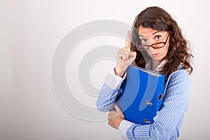 The business woman is holding a file in her hands