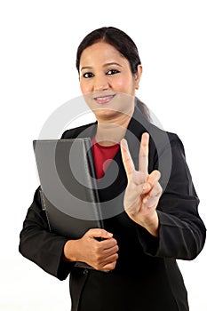 Business woman holding folder and making victory sign