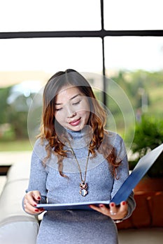 Business woman holding with folder in office