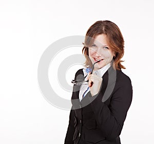 Business woman holding glasses in mouth