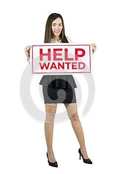 Business woman holding help wanted sign. Business woman showing placard.