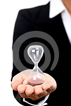 Business woman holding hourglass