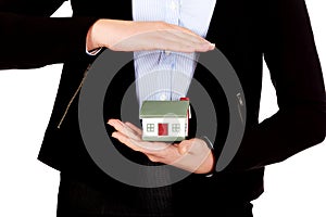 Business woman holding house model