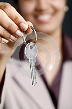 Business woman holding key
